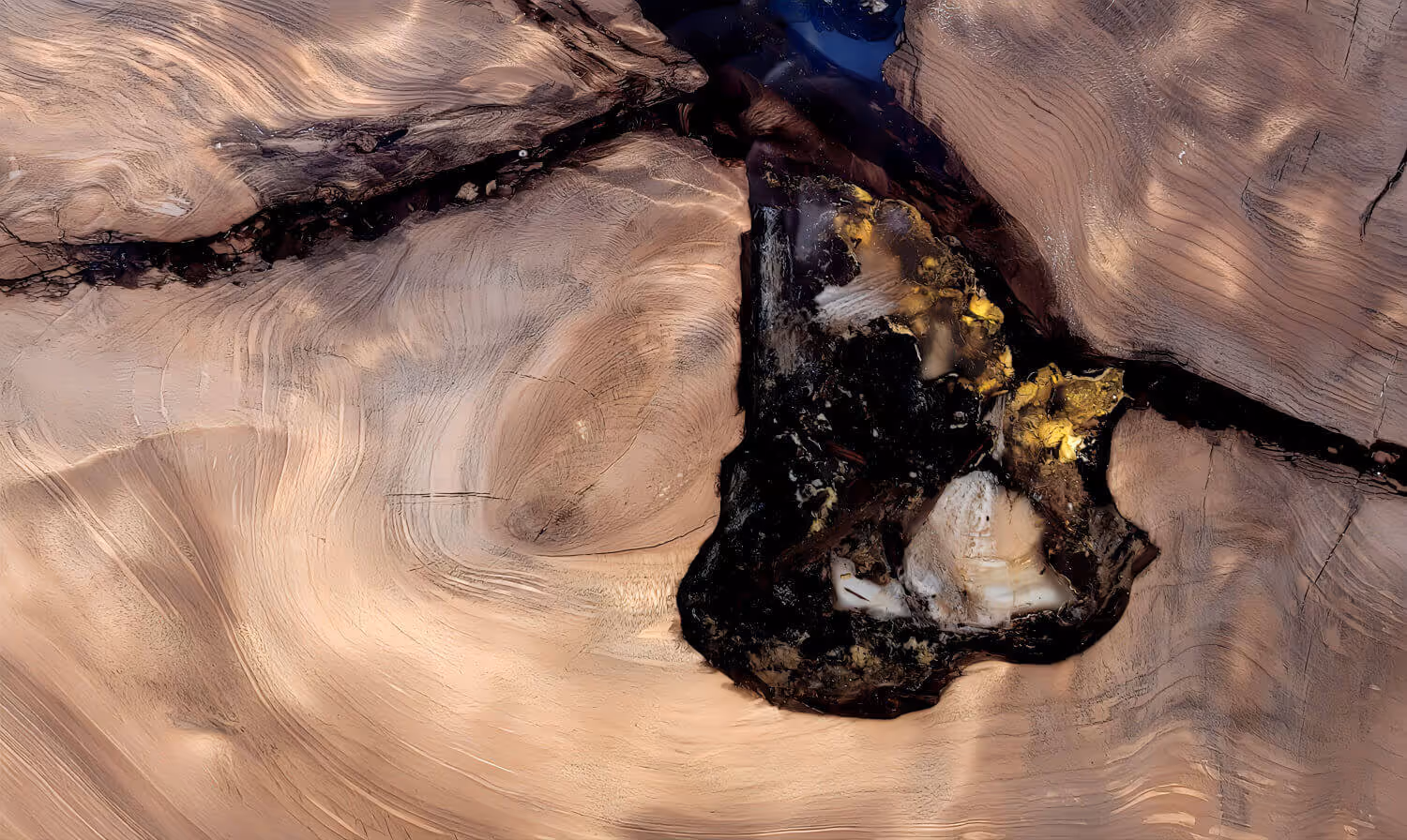Gold-colored amber embedded in epoxy resin in the tabletop of a unique table crafted by a master cabinetmaker for exclusive interior design projects, serving as a custom dining table