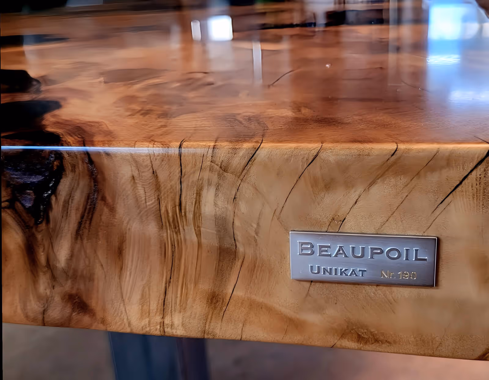 A custom-made, one-of-a-kind Kauri designer table featuring a handcrafted burl wood tabletop, designed to last a lifetime