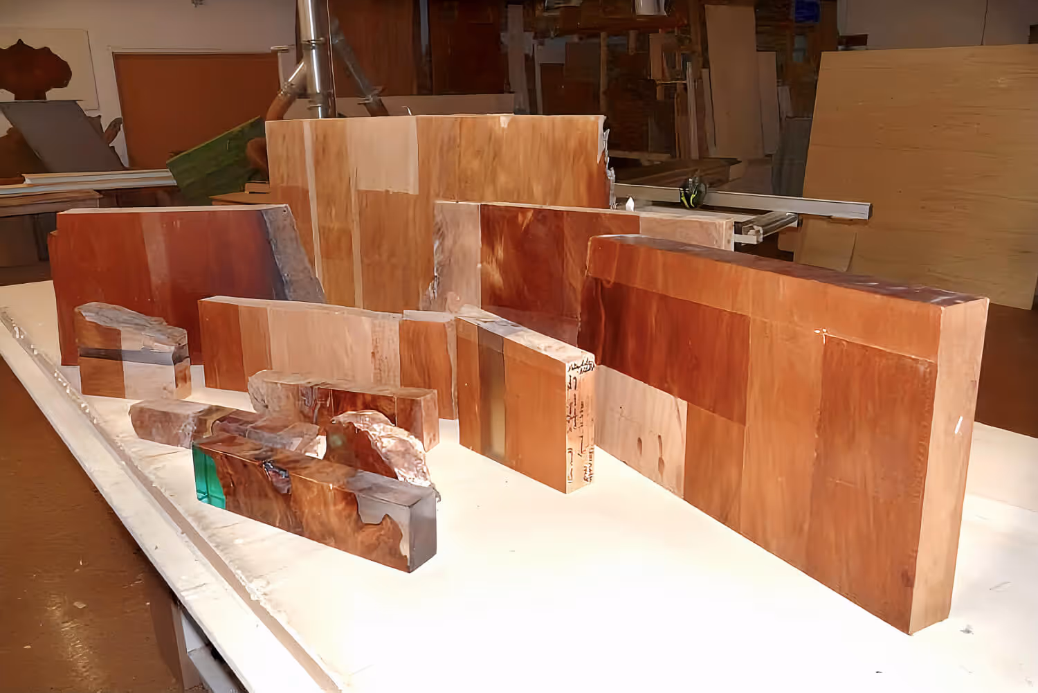 Experiments with kauri wood using various finishing techniques by a master cabinetmaker to create a high-quality table
