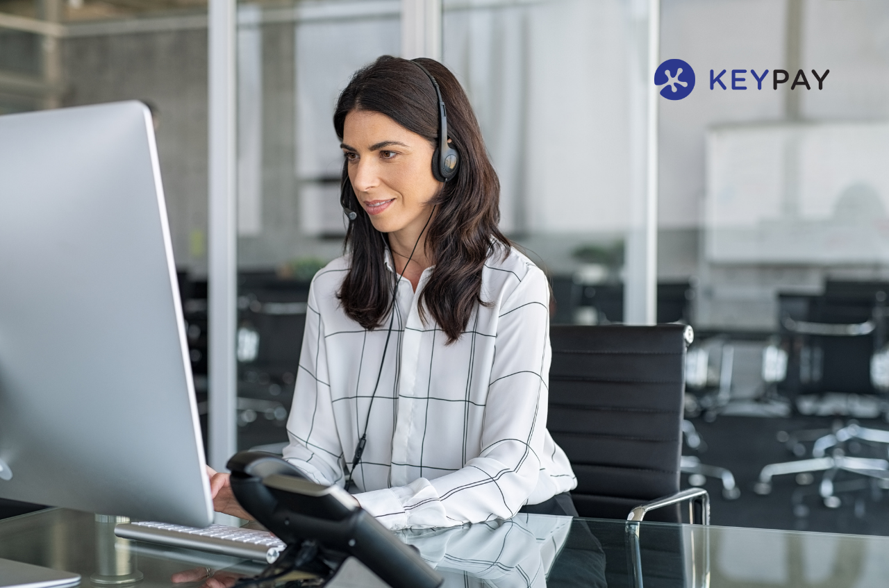 Woman using computer in office.