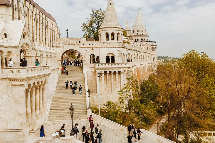 A group of people walking up and down some stairs