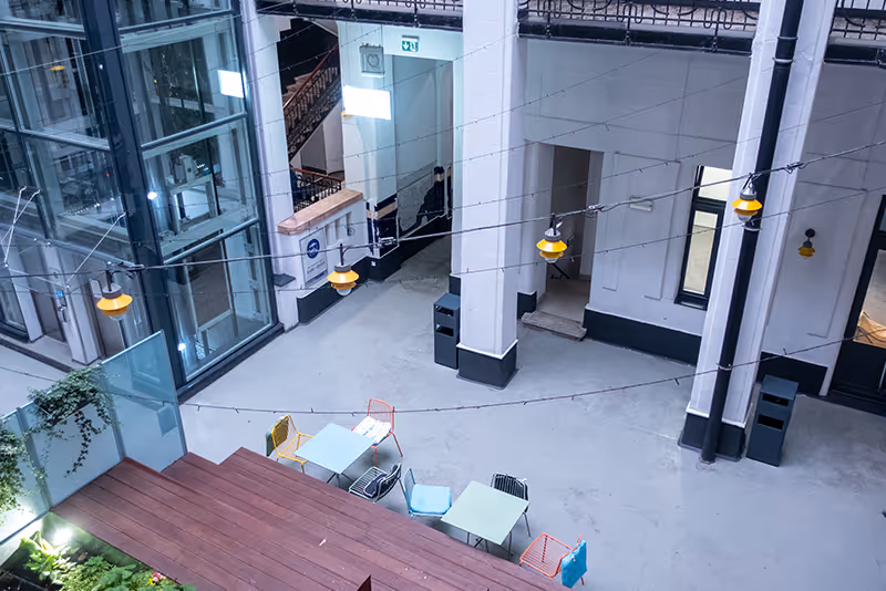 An overhead view of a building with tables and chairs