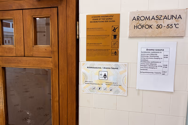 A wooden door with a sign on the side of it