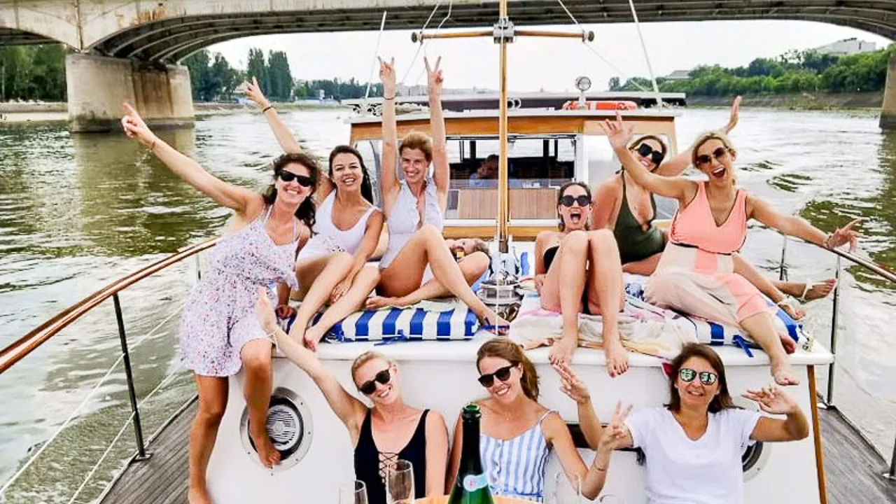 A group of women sitting on top of a boat