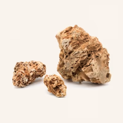 A rock and two pieces of rock on a white background
