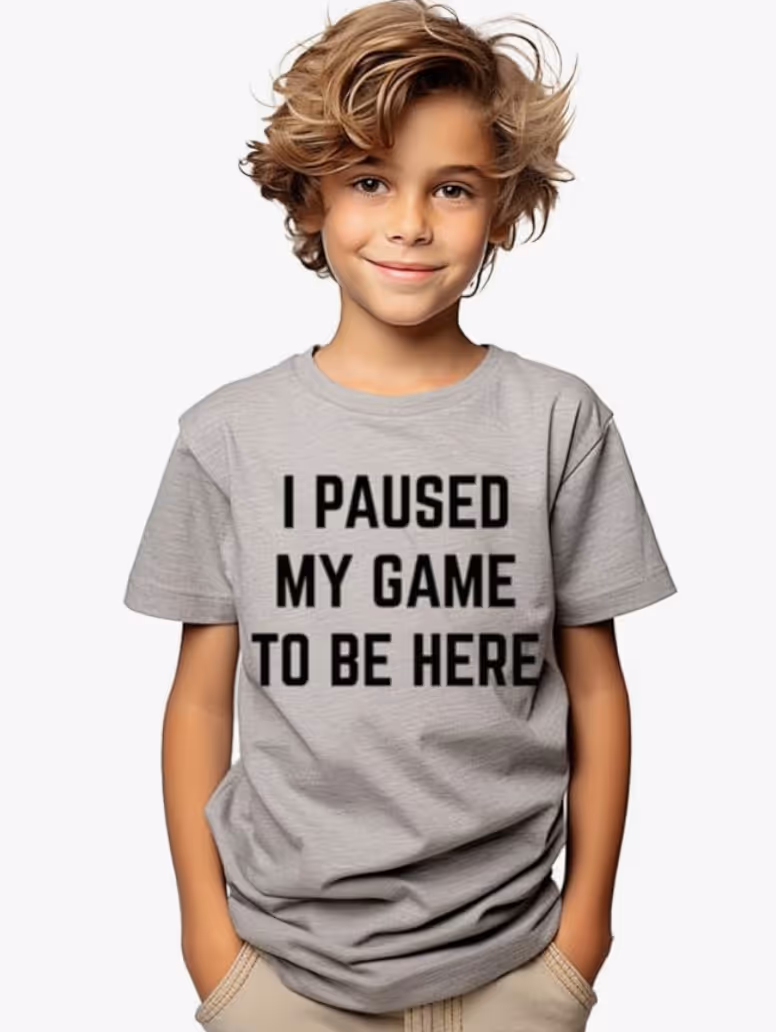 gamer kid wearing "I paused my game to be here" shirt