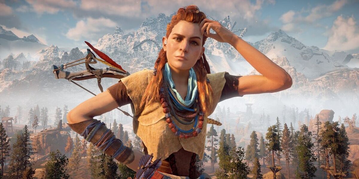 An image of Aloy from Horizon Zero Dawn, a red-headed young woman. She stands scratching her head.