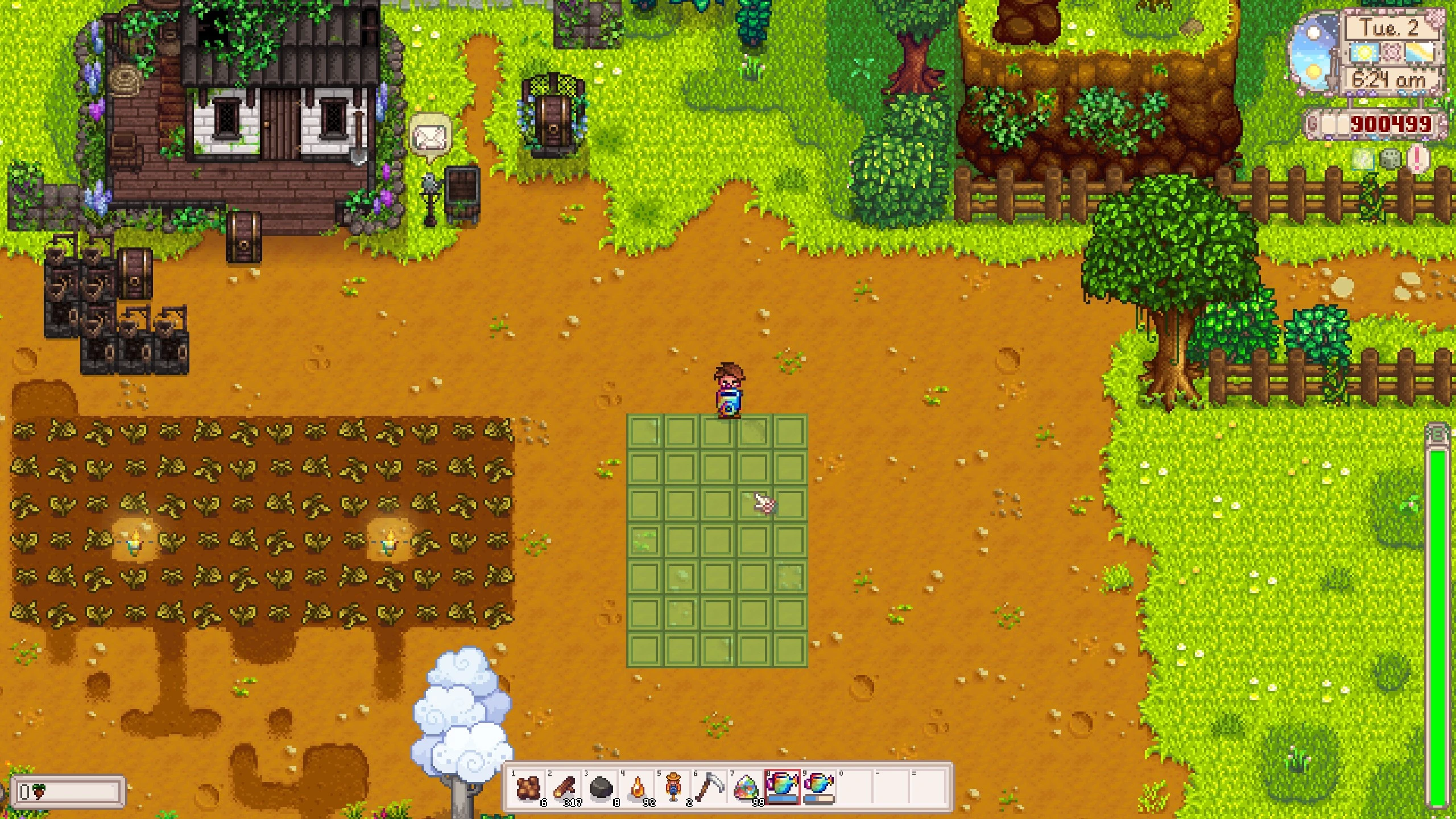farmer watering a large number of tiles at once using a prismatic watering can
