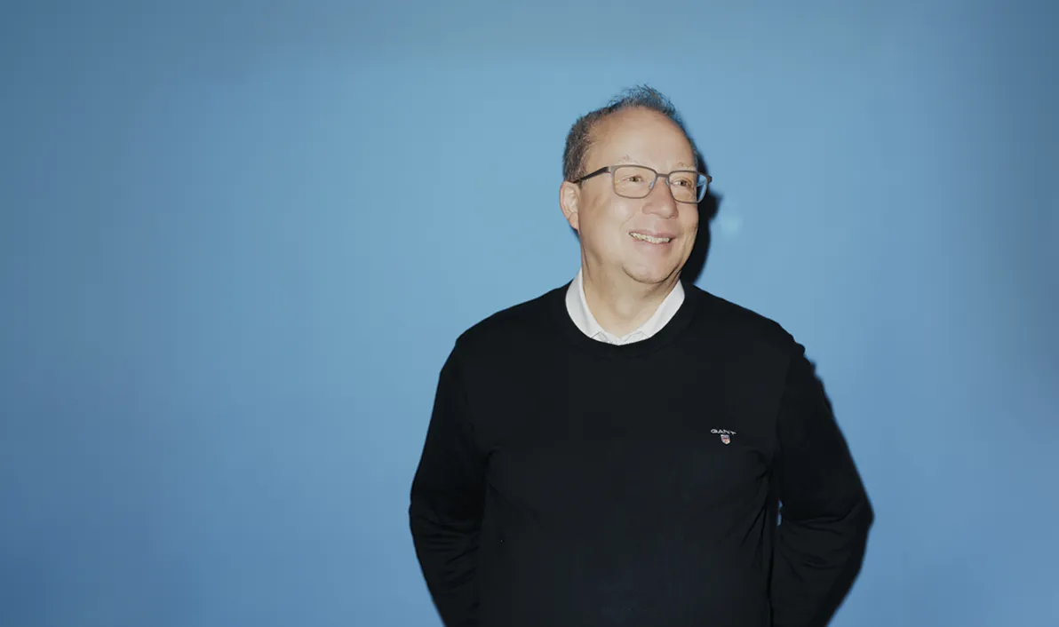 Kim Black, Purchasing Director, Hørkram in front of a blue background