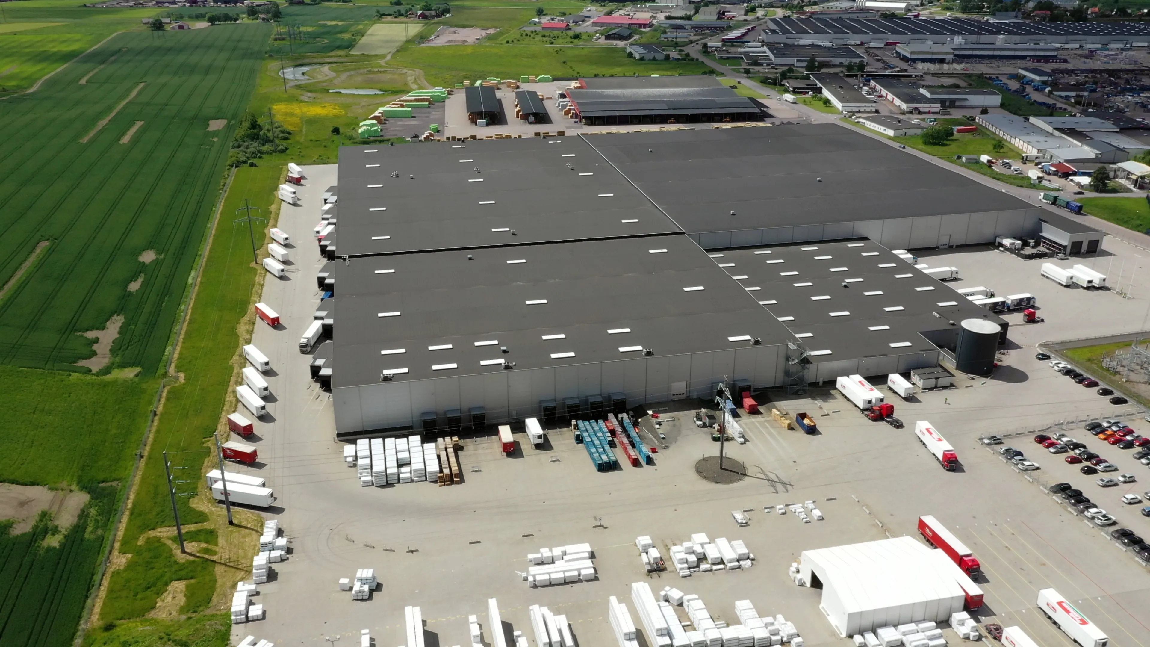 A large Frode Laursen sign on the front of a warehouse building