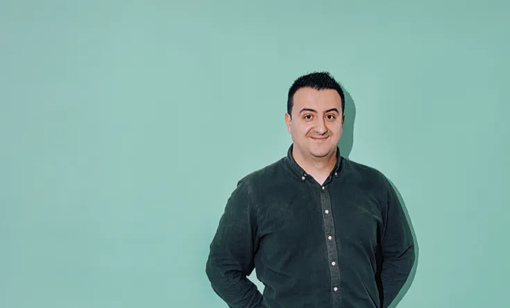 Semir Bojcic, Senior Data Governance Consultant, Salling Group in front of a blue background