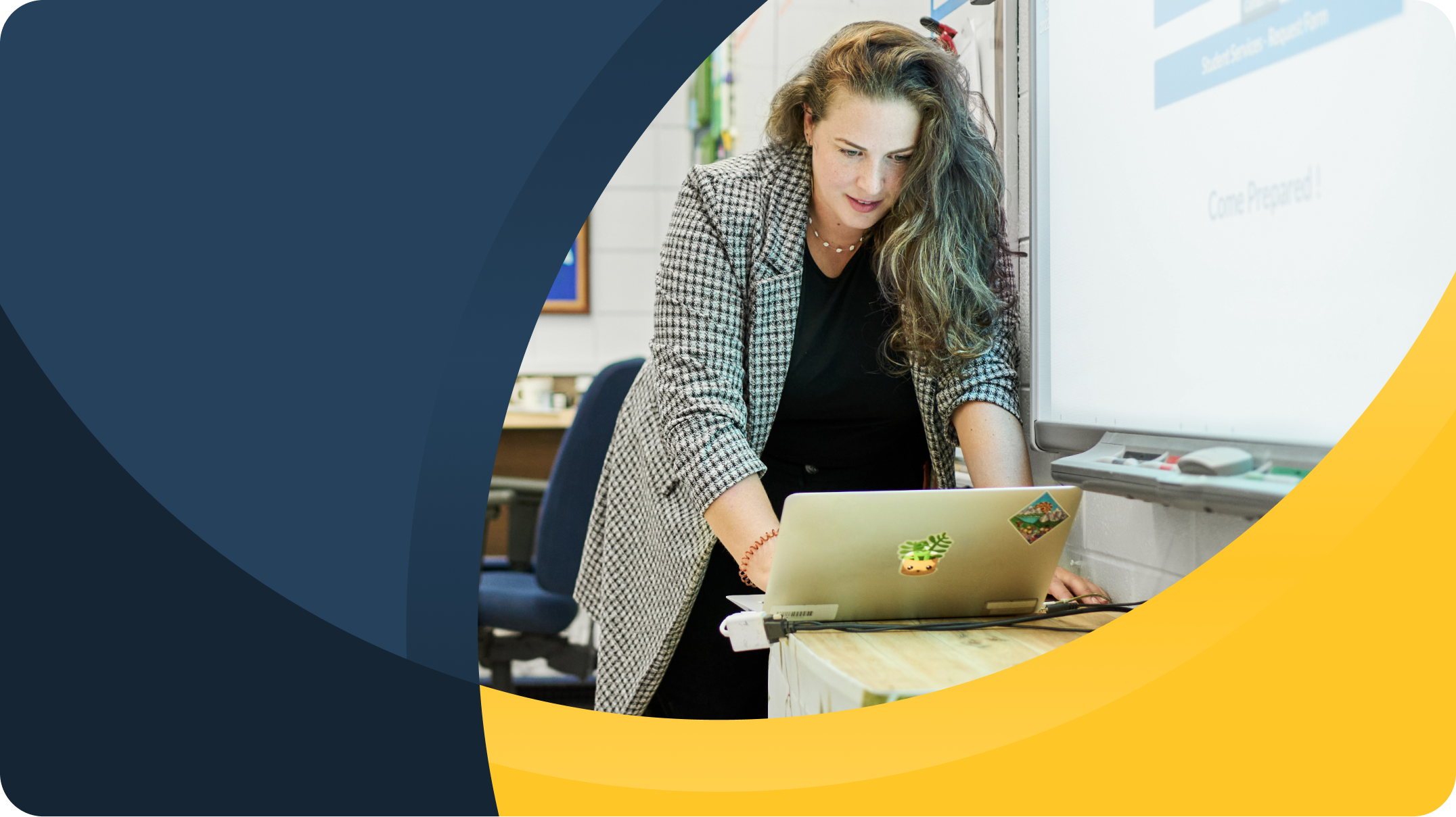 A teacher standing at her laptop