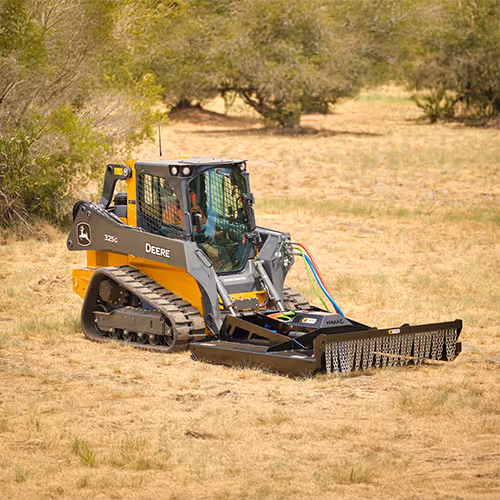 John Deere Skidsteer with brush clearing attachment