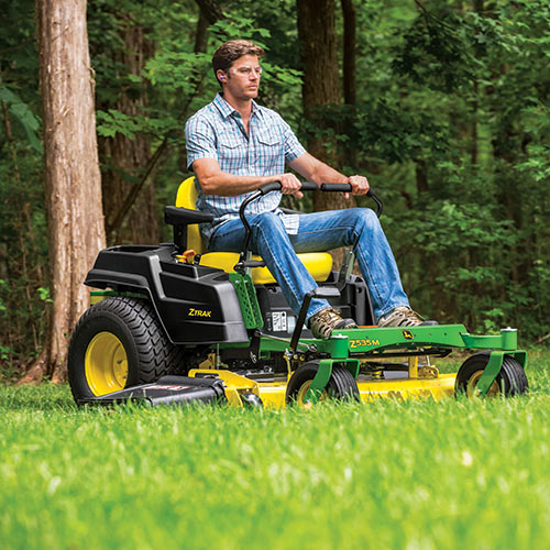 John Deere z-track lawn mower cutting grass