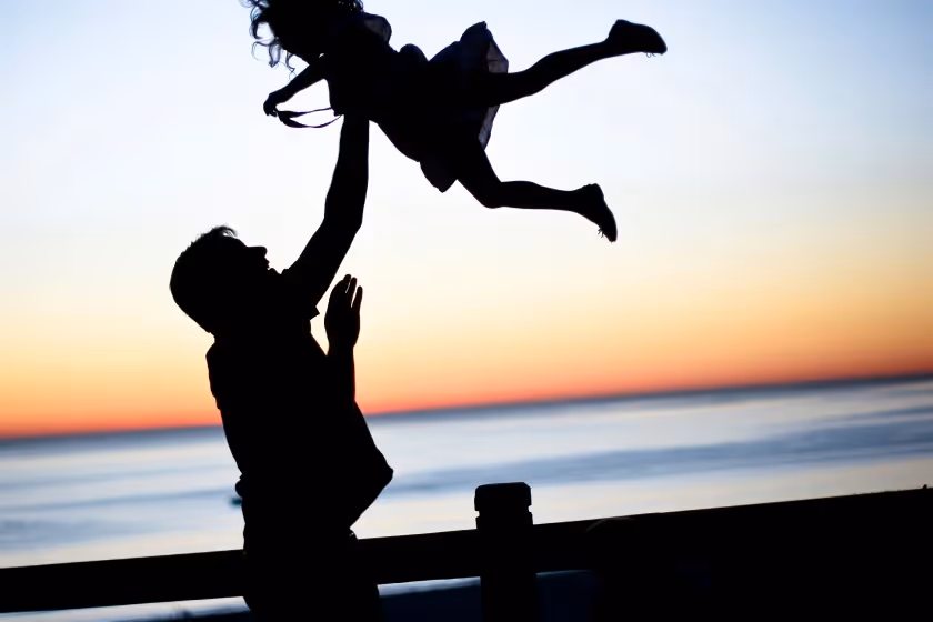 A father playing with his daughter