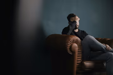 Man holding his head