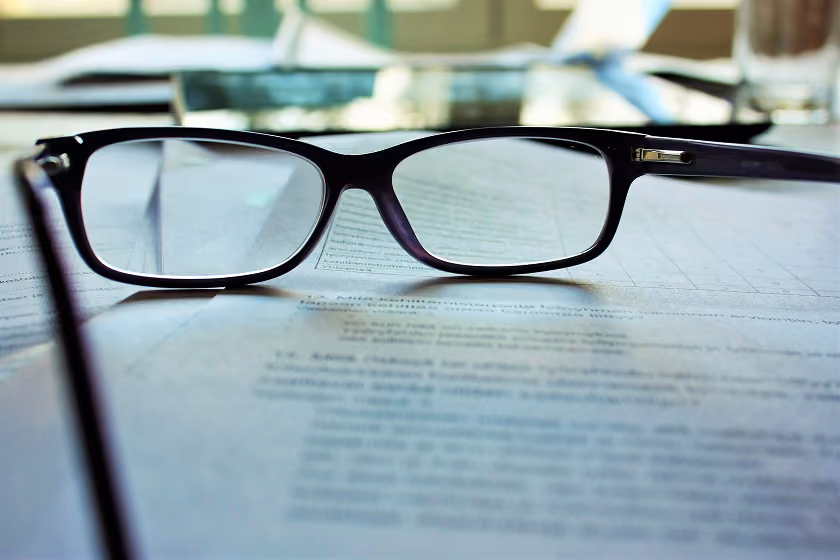 Reading glasses on legal documents