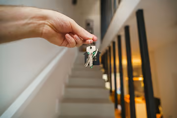 New home owner holding their new house keys