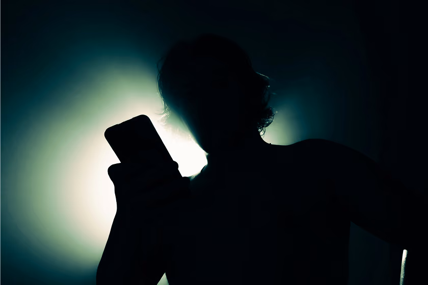Person watching a recording on their phone