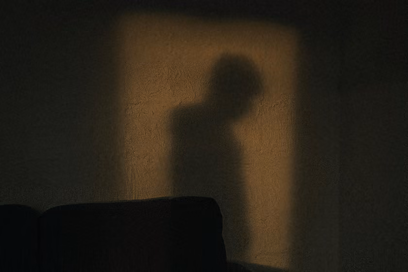 Person hiding in the shadows