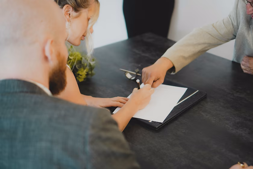 woman signing papers