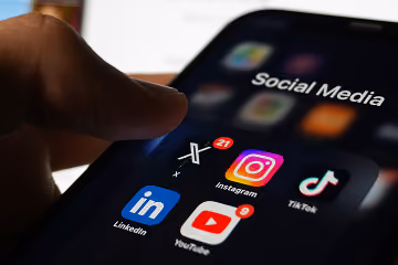 Social meia icons on a mobile hone