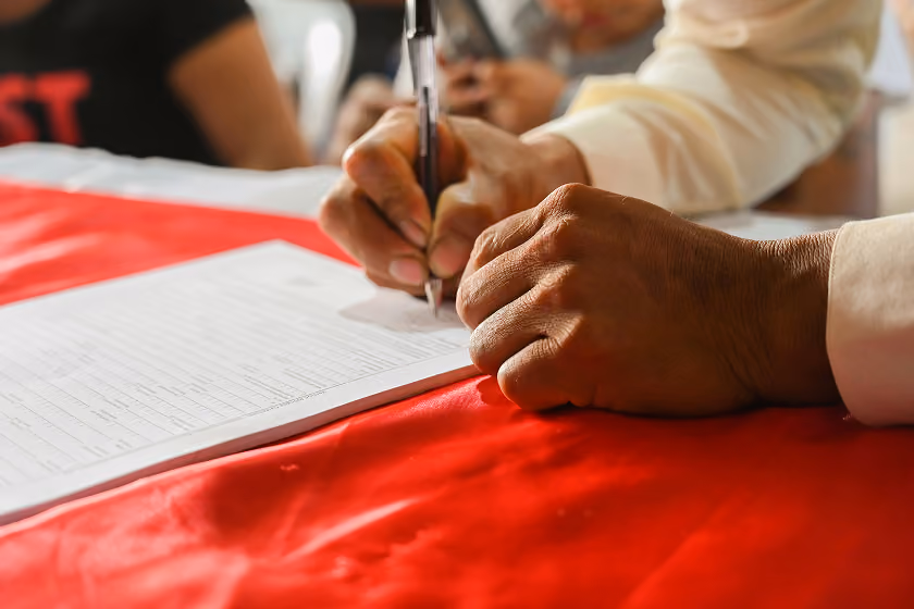 Man signing a document