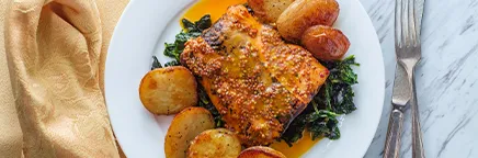 Glazed salmon with green and baked potatoes private chef meal