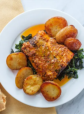 Glazed salmon with green and baked potatoes private chef meal