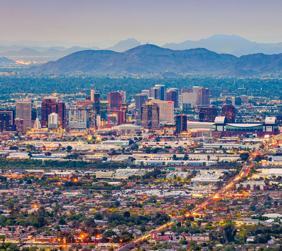 Private chef Phoenix city skyline photo with desert mountains and palms at sunset