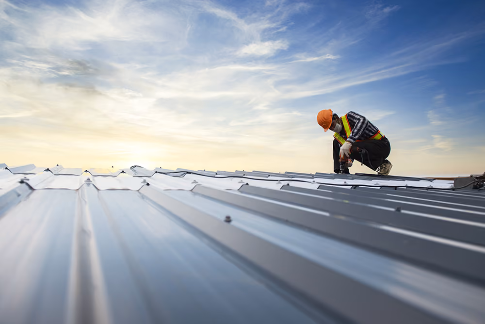 Roofer at sunset