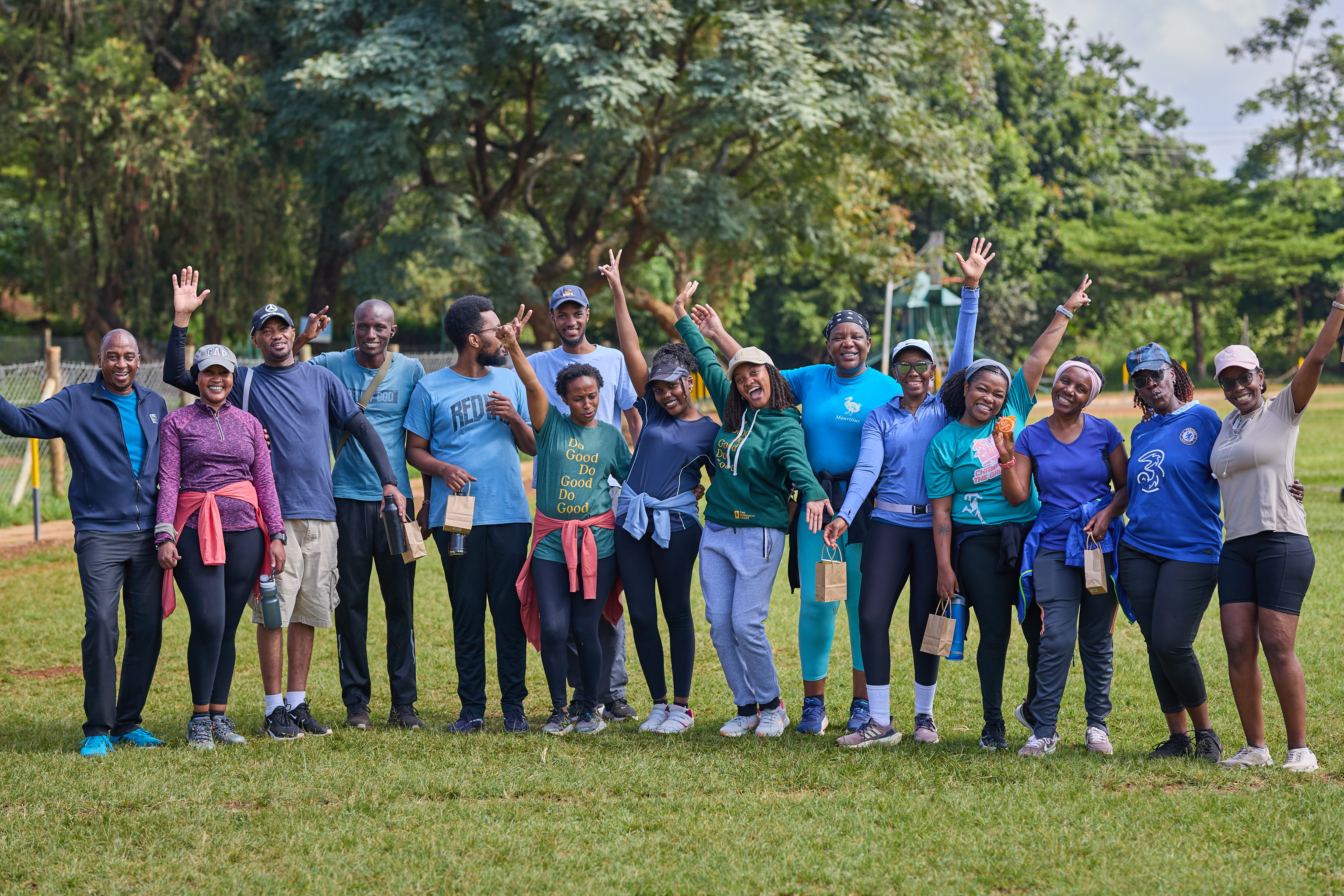 A group of people smiling with hands waving before the 6K for Water walk in Nairobi, Kenya in 2025