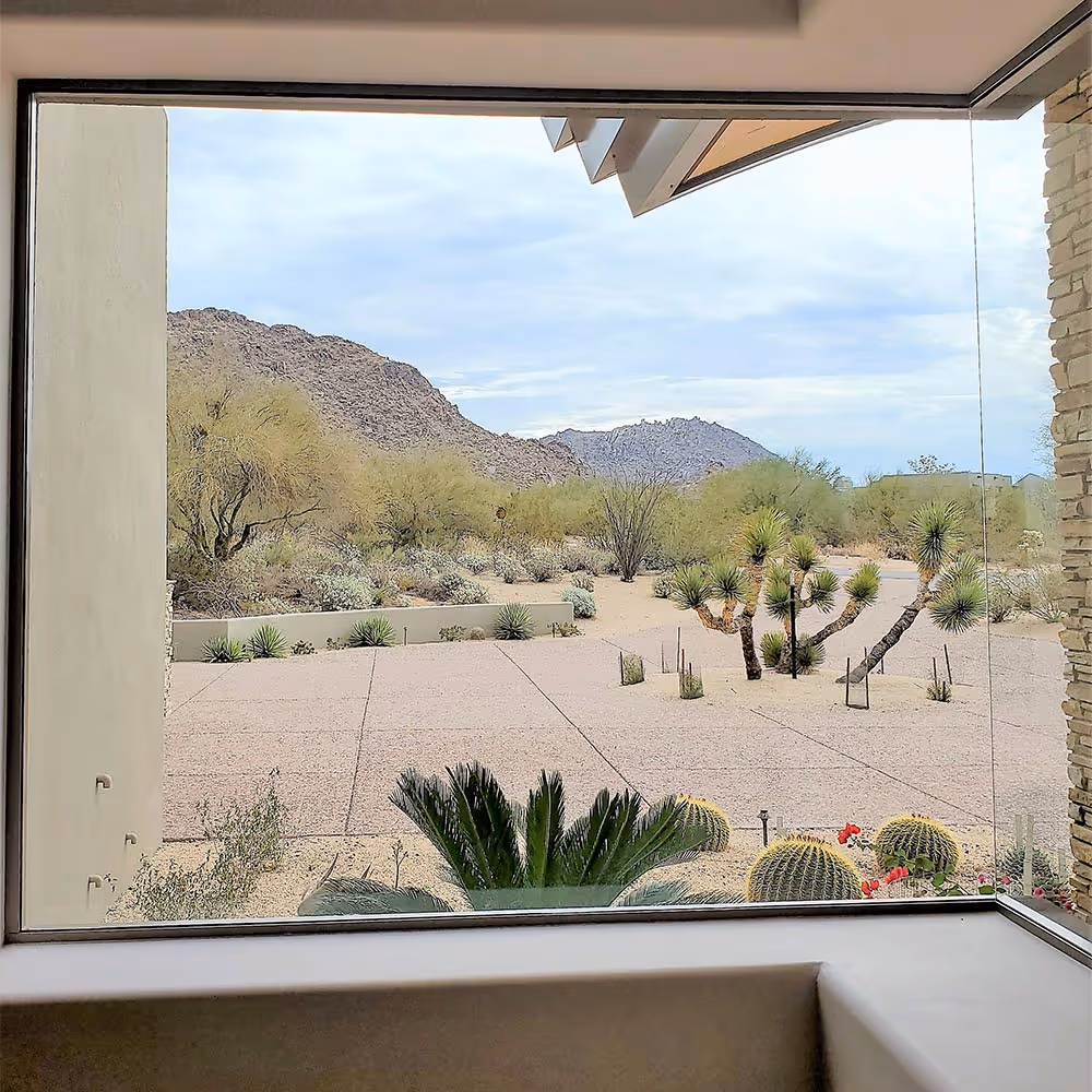Corner window view of mountains in Phoenix, AZ out of sparkling clean windows