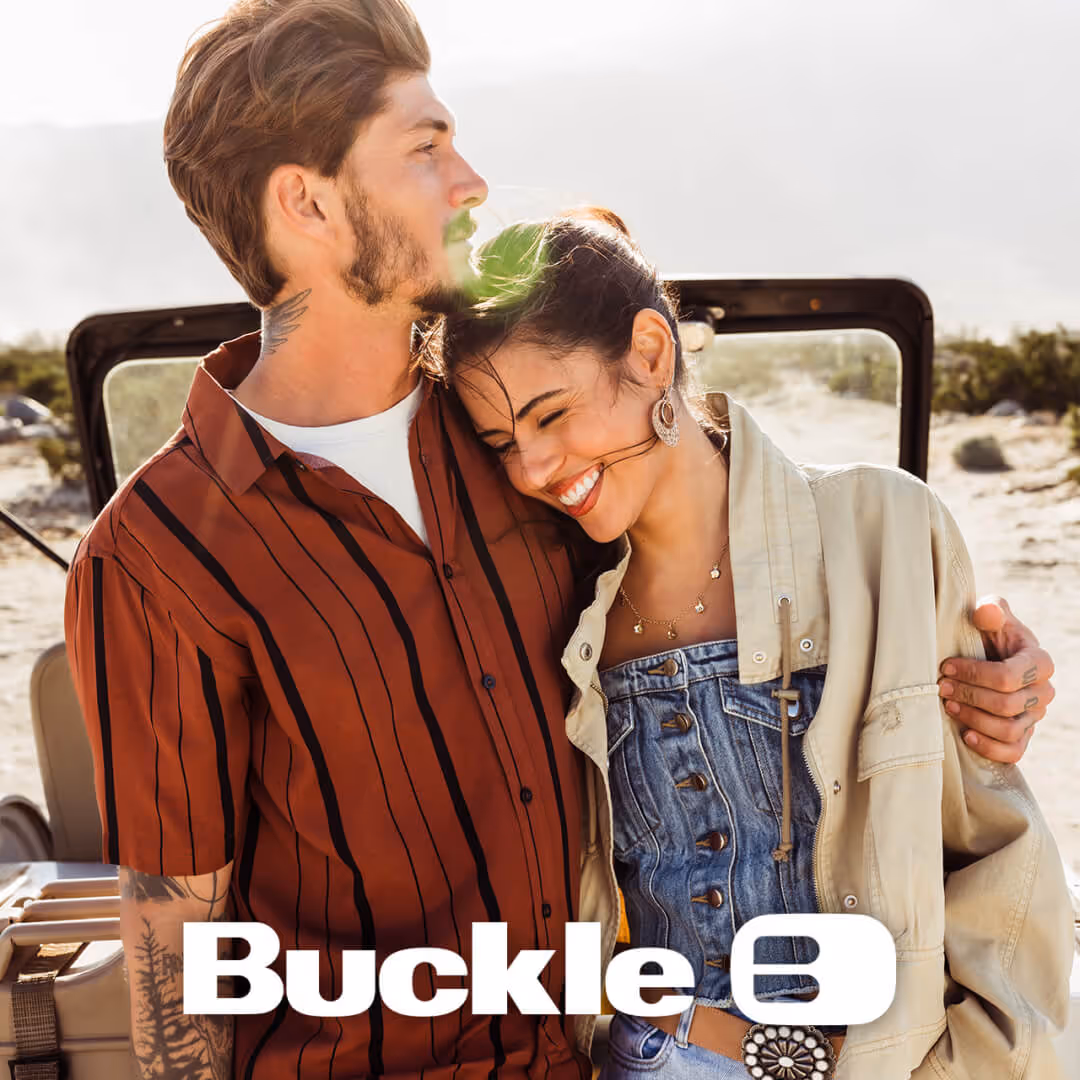 Couple wearing Buckle apparel embracing