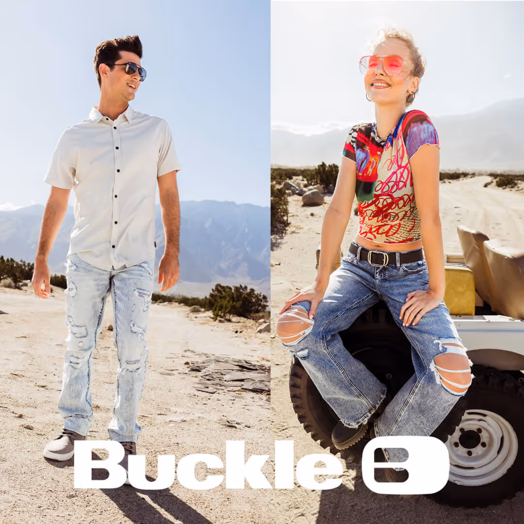 Models wearing Buckle apparel on a beach