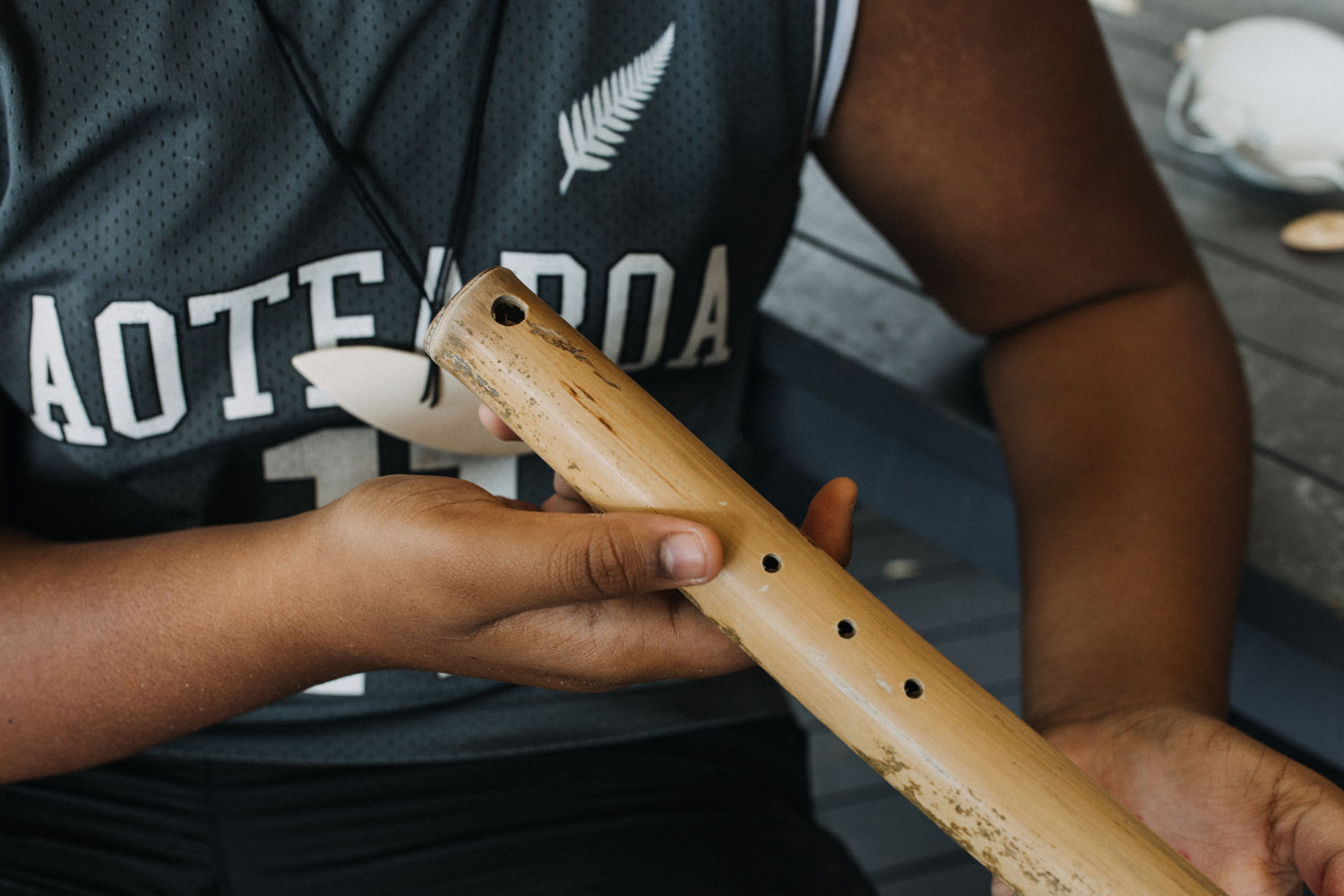 Romi works on his art as part of Ngā Rangatahi Toa's Hā – Breathe exhibition
