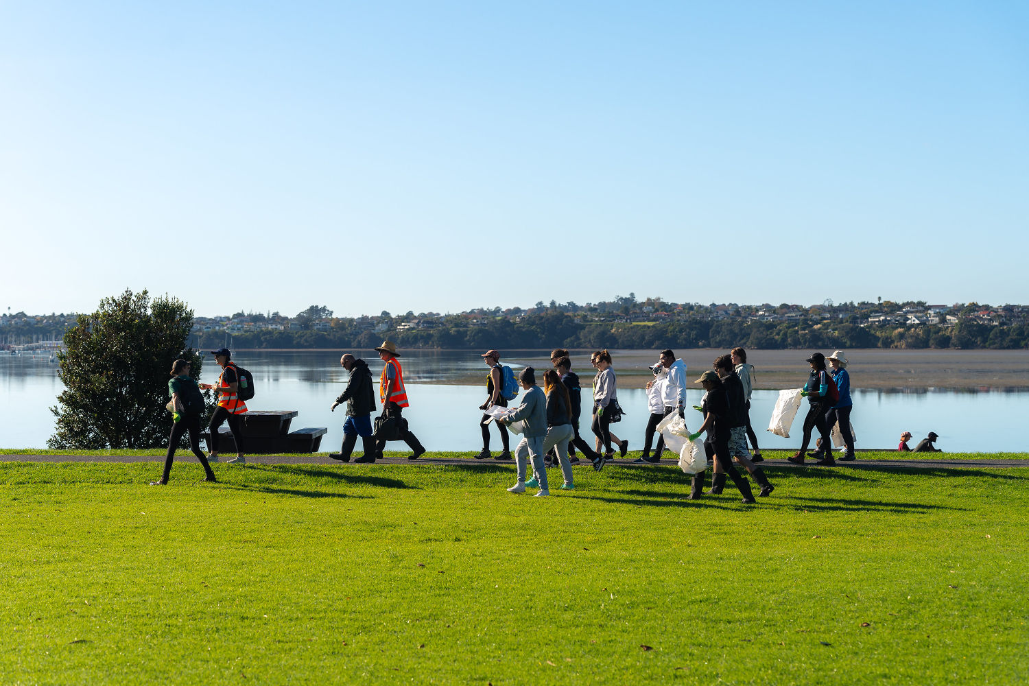 Volunteers and Sustainable Coastlines staff participate in a beach clean-up.