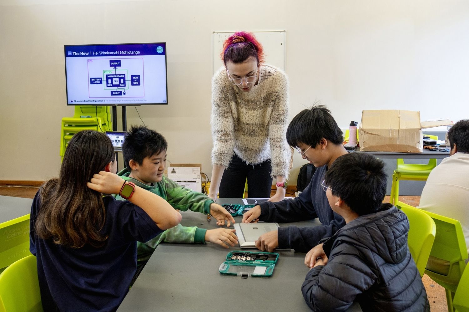 Riley Pugh teaches skills to students enabling them to recycle electronic devices.