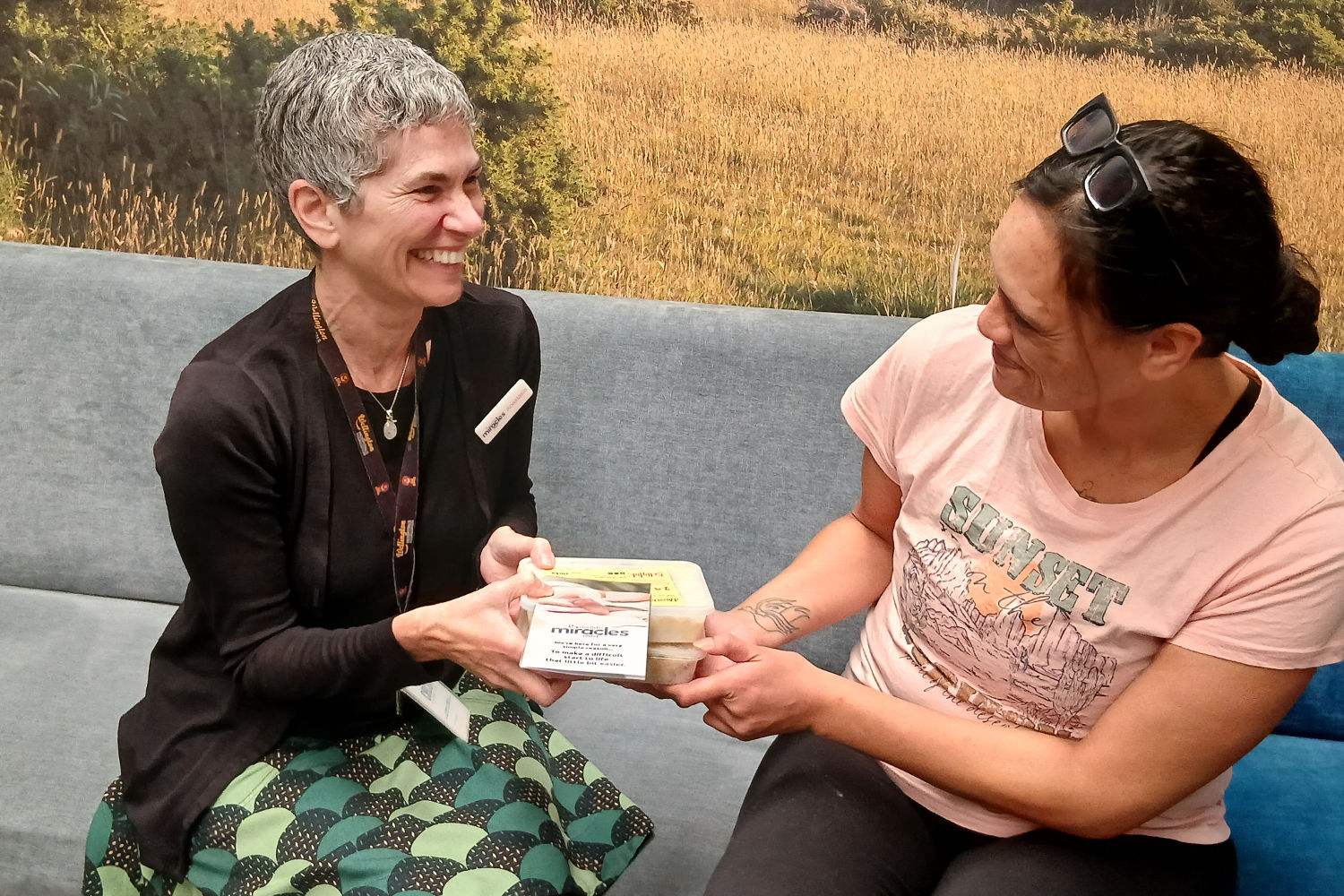 A NICU parent receives a meal from a volunteer from The Little Miracles Trust. 
