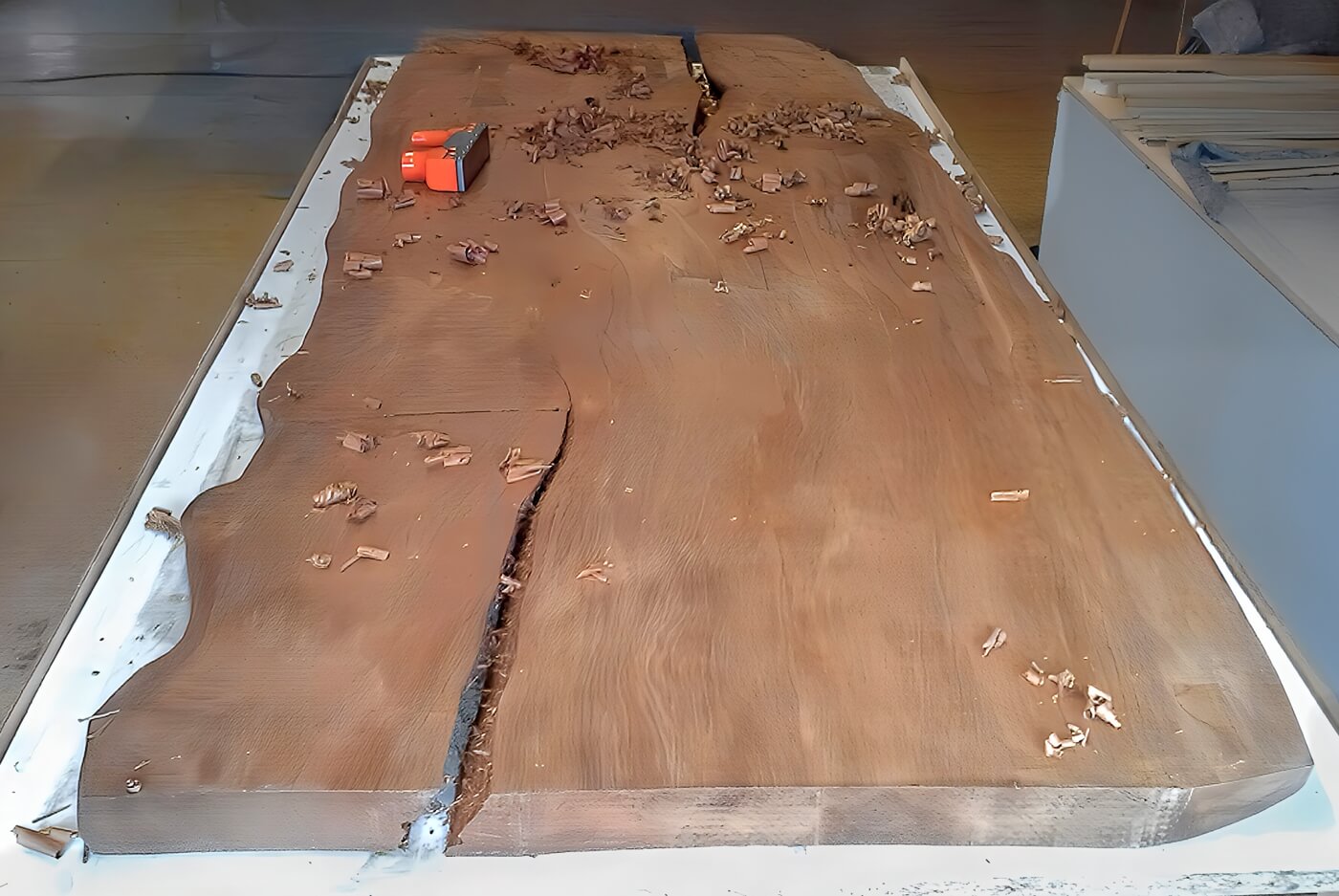 Unfinished tabletop of a one-of-a-kind, handcrafted table, custom-made in a master carpenter’s workshop according to the customer’s specifications as a designer dining table