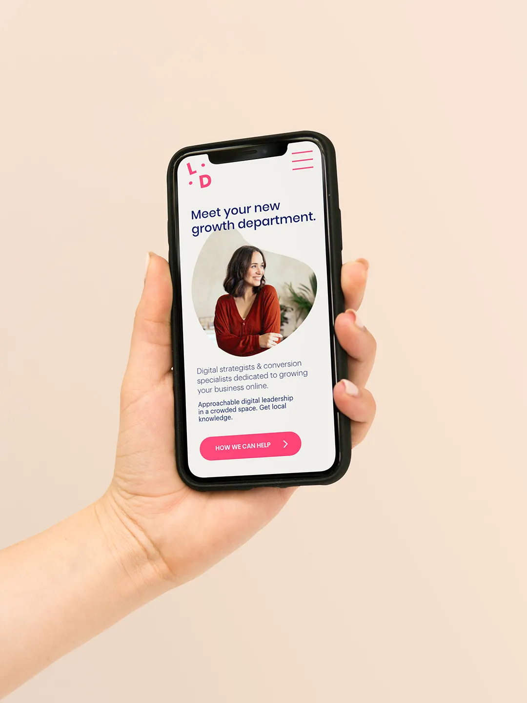 hand holding iphone with local digital landing page