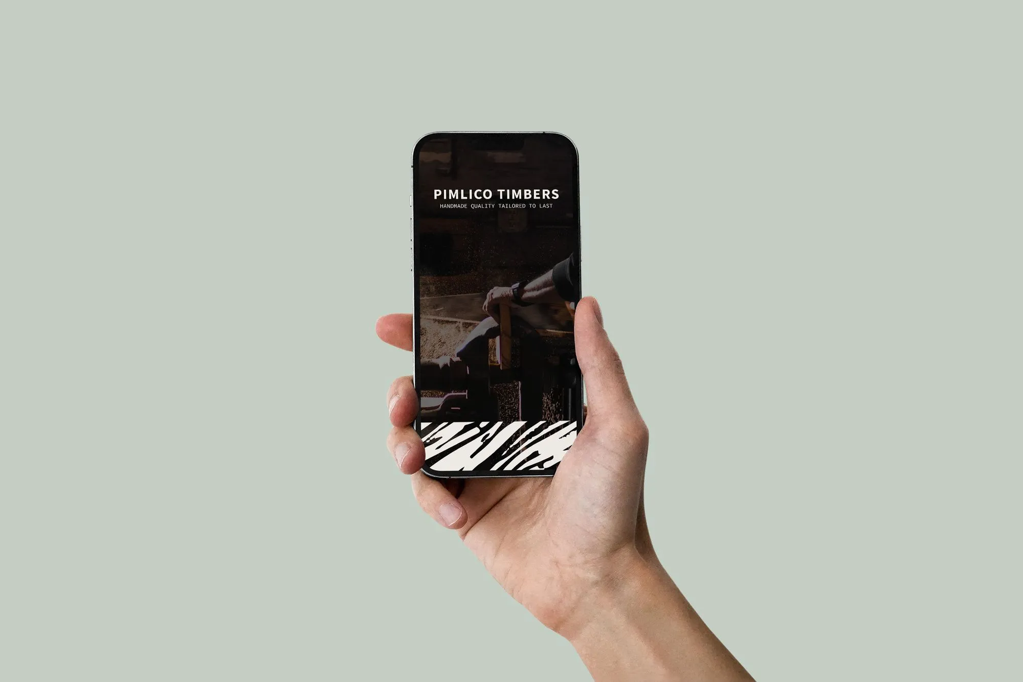Hand holding phone showing Pimiico Timber Branding