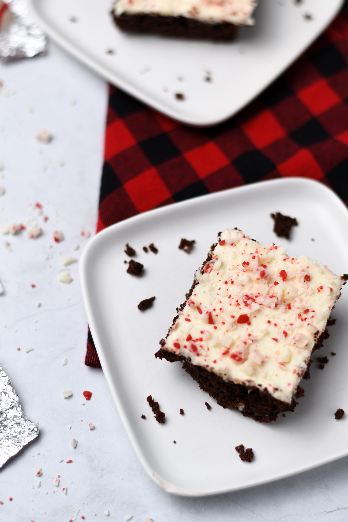 A slice of gluten free chocolate sheet cake with peppermint icing