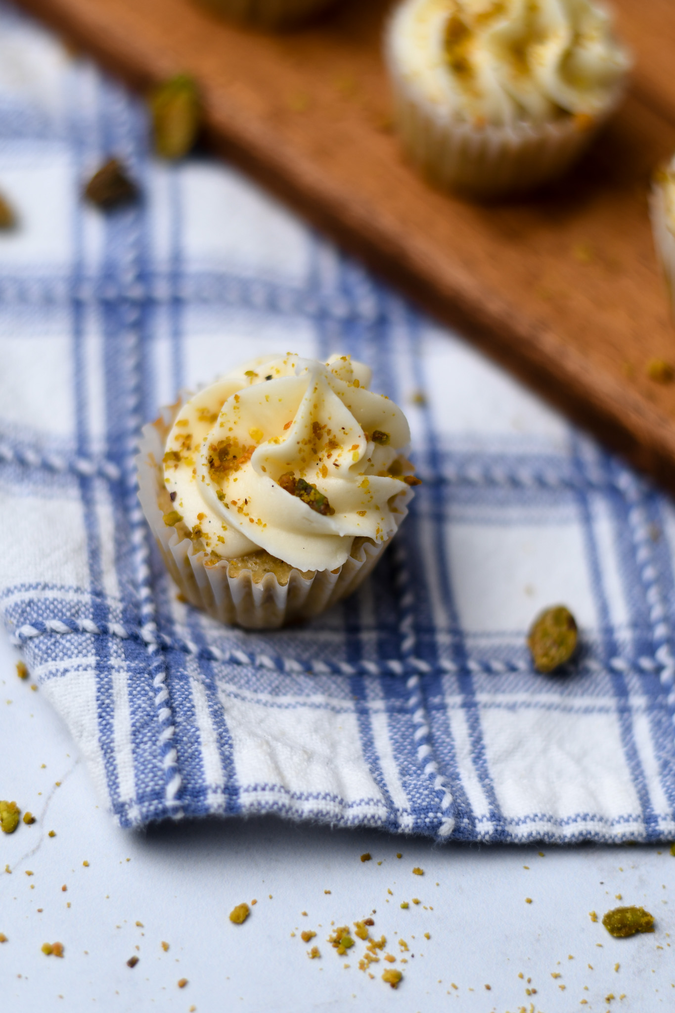Mini gluten free pistachio cupcakes with a vanilla buttercream