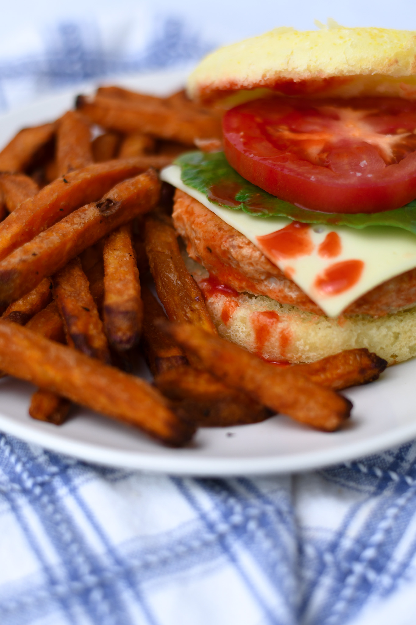 spicy buffalo chicken burger layered with tomato and lettuce