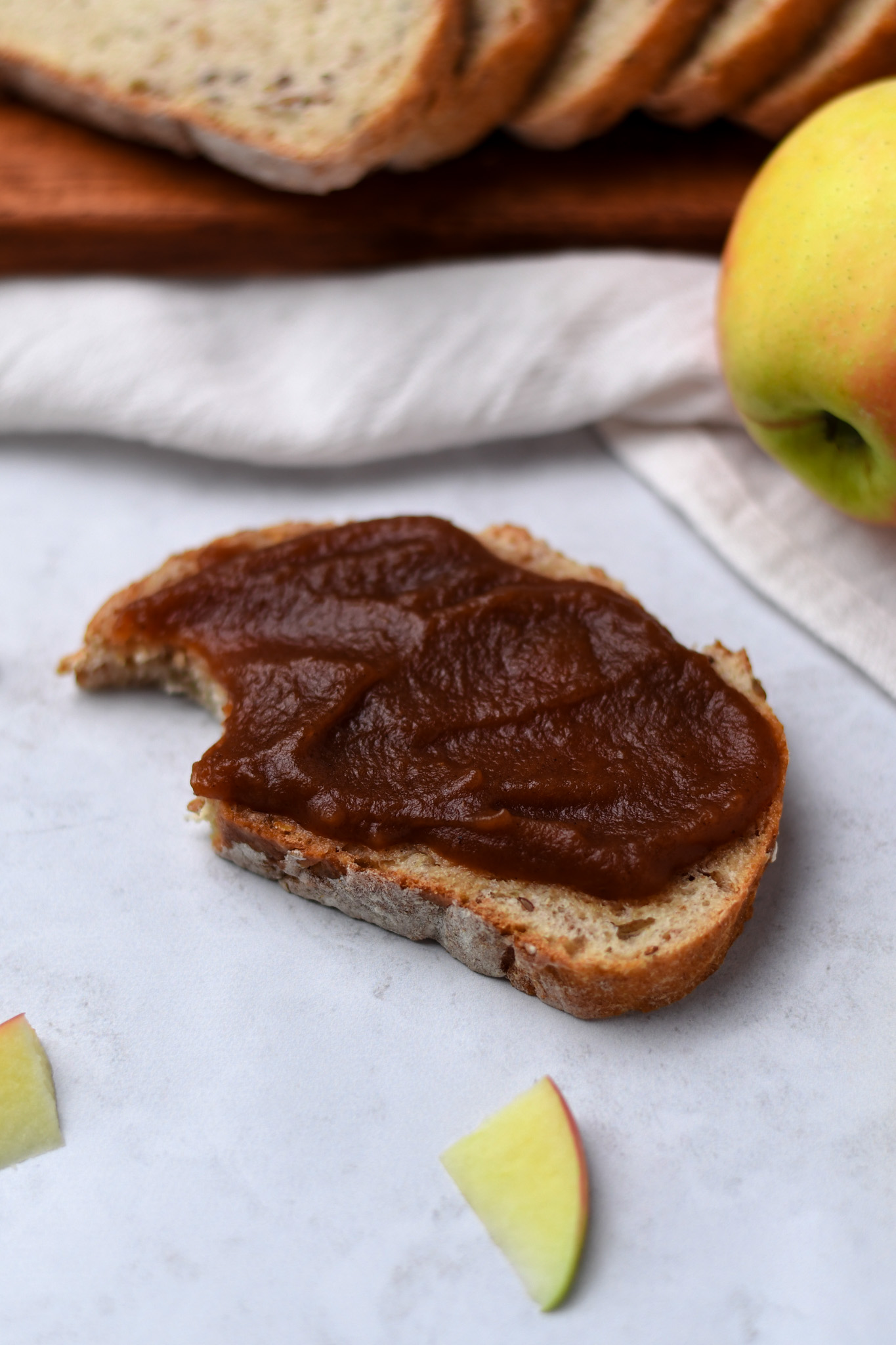 Homemade slow cooker apple butter on a piece of gluten free bread