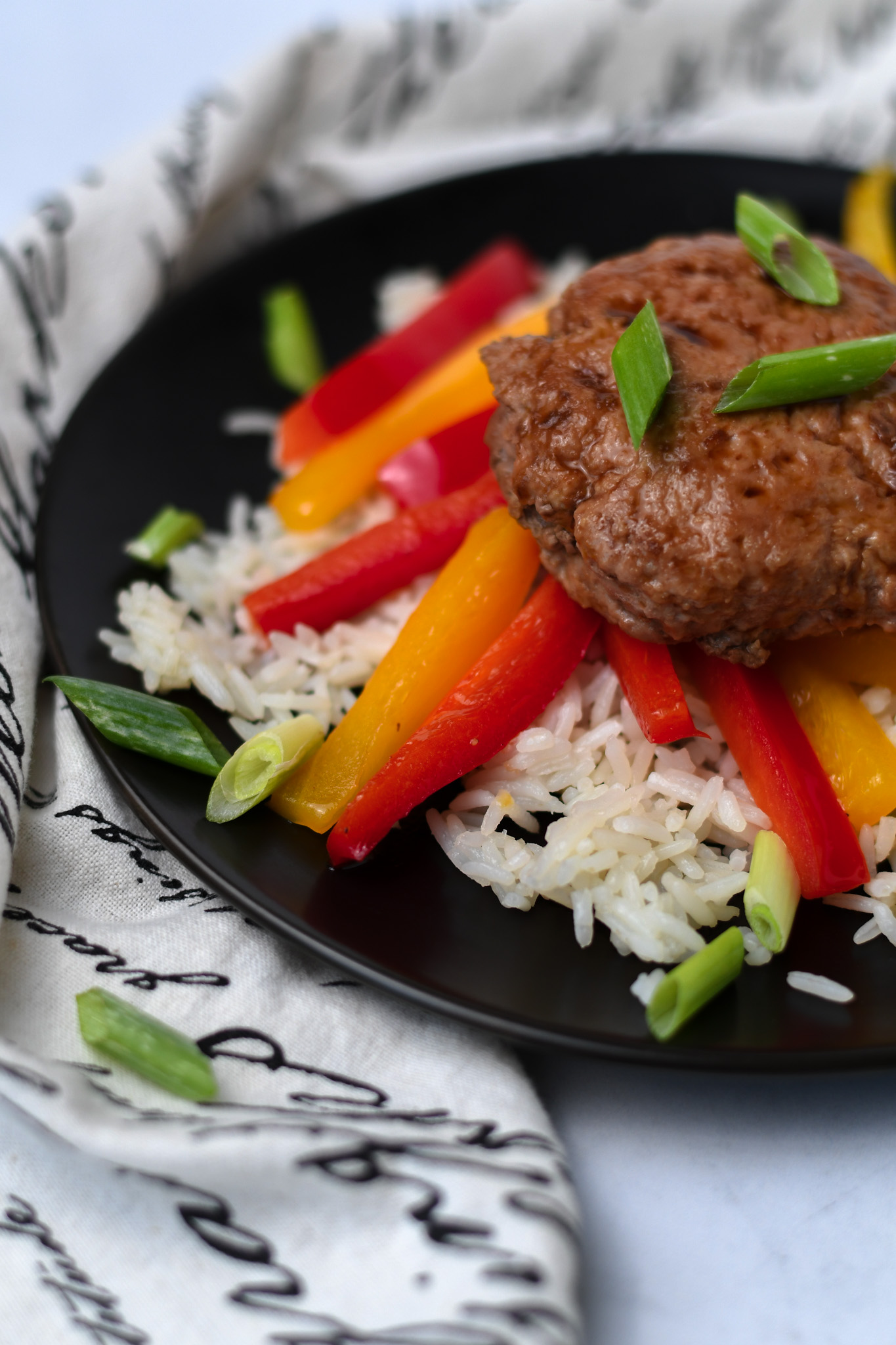 thai turkey burger served with rice and sauteed peppers