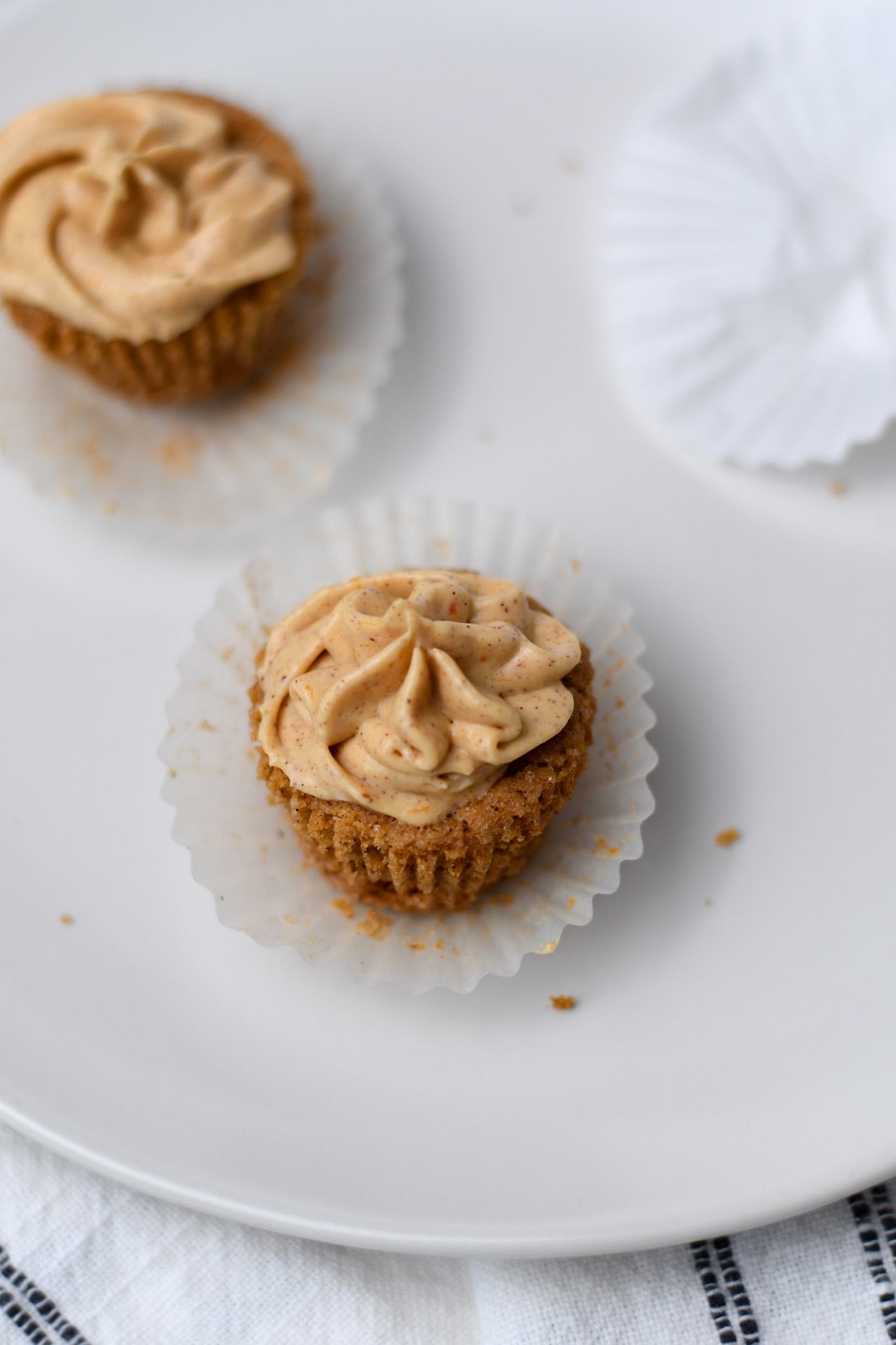 gluten free mini pumpkin cheesecakes on a white plate