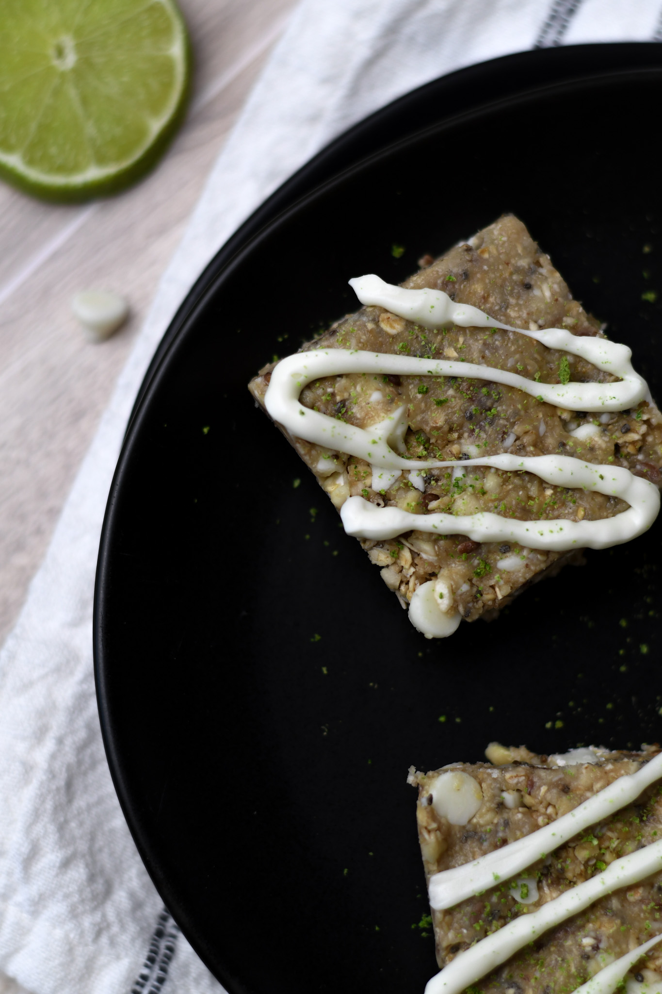 Gluten free key lime granola bars on a black plate
