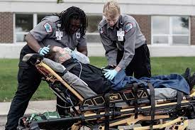 Two paramedics transporting a patient